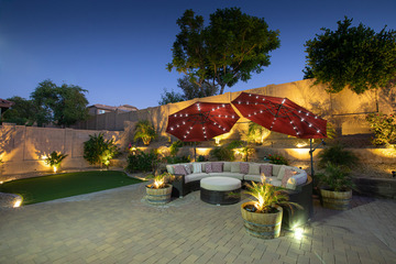 Covered backyard seating at dusk at Norterra Assisted Living.